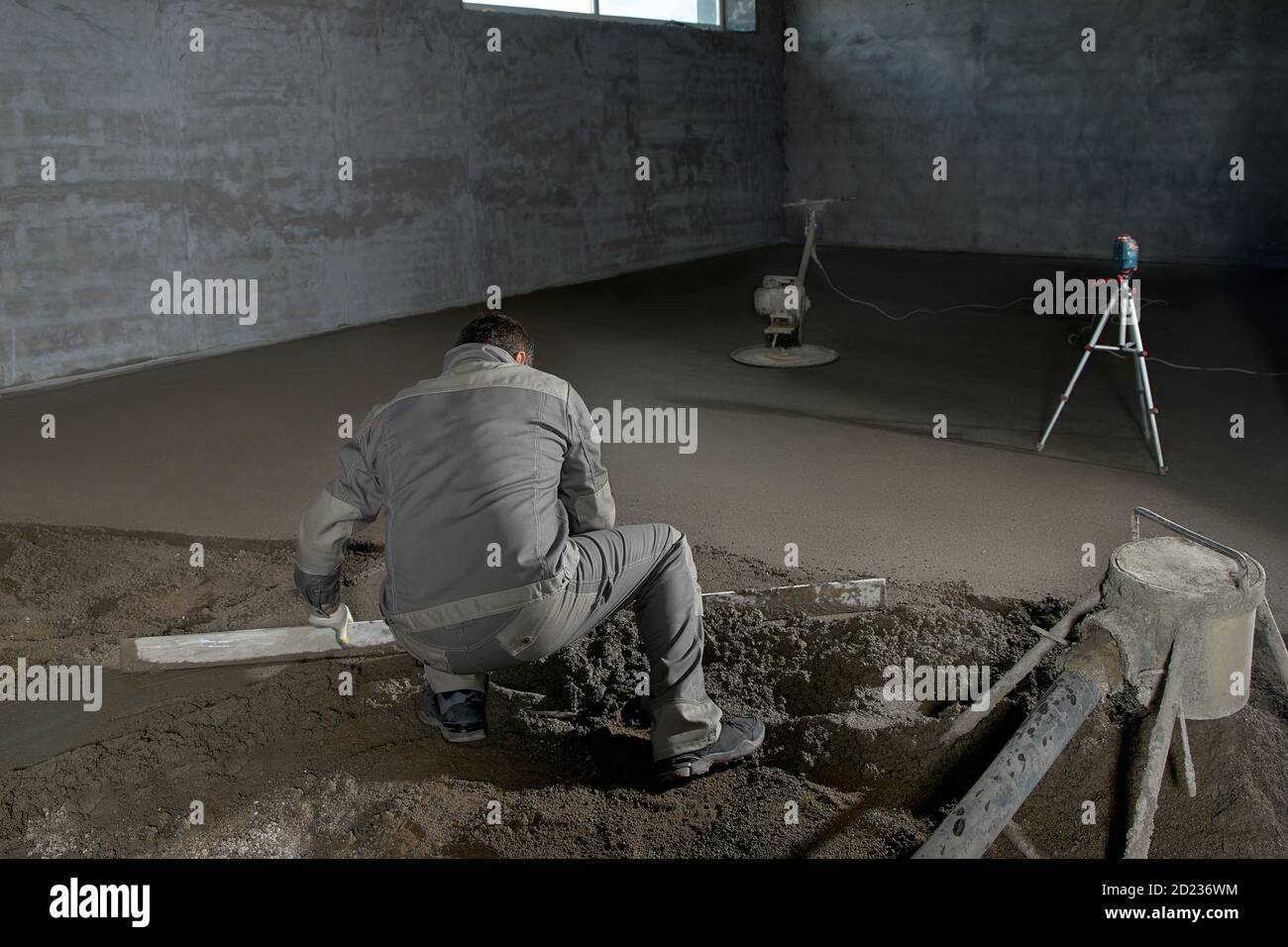 Filling the floor with concrete, screed and leveling the floor by ...