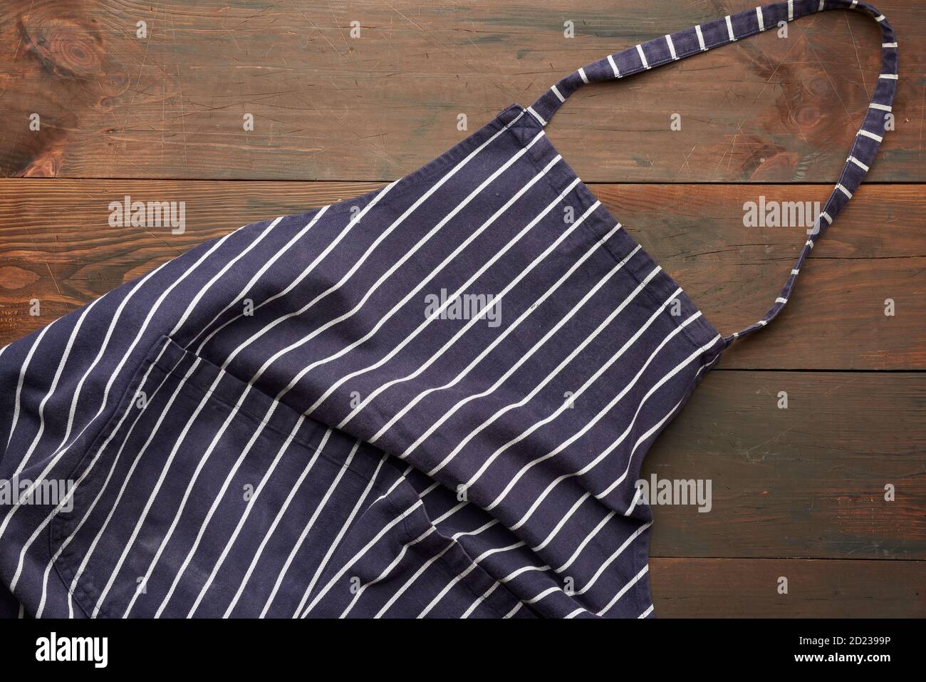 blue textile kitchen apron with white stripes, top view Stock Photo - Alamy