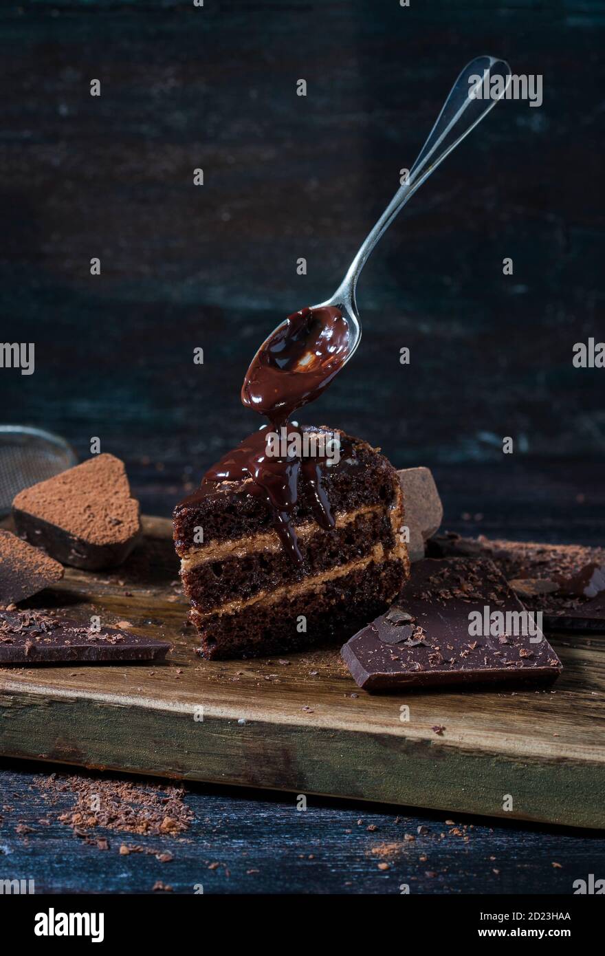 Chocolate brownie, dark chocolate over wooden background Stock Photo