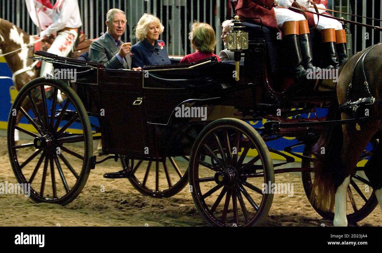 britains-prince-charles-l-and-his-wife-camilla-the-duchess-of-cornwall-arrive-in-an-horse-drawn-carriage-to-open-canadas-royal-agricultural-winter-fair-in-toronto-november-6-2009-prince-charles-and-camilla-are-currently-on-an-11-day-tour-of-canada-reutersfred-thornhill-canada-politics-royals-2D23JA4.jpg