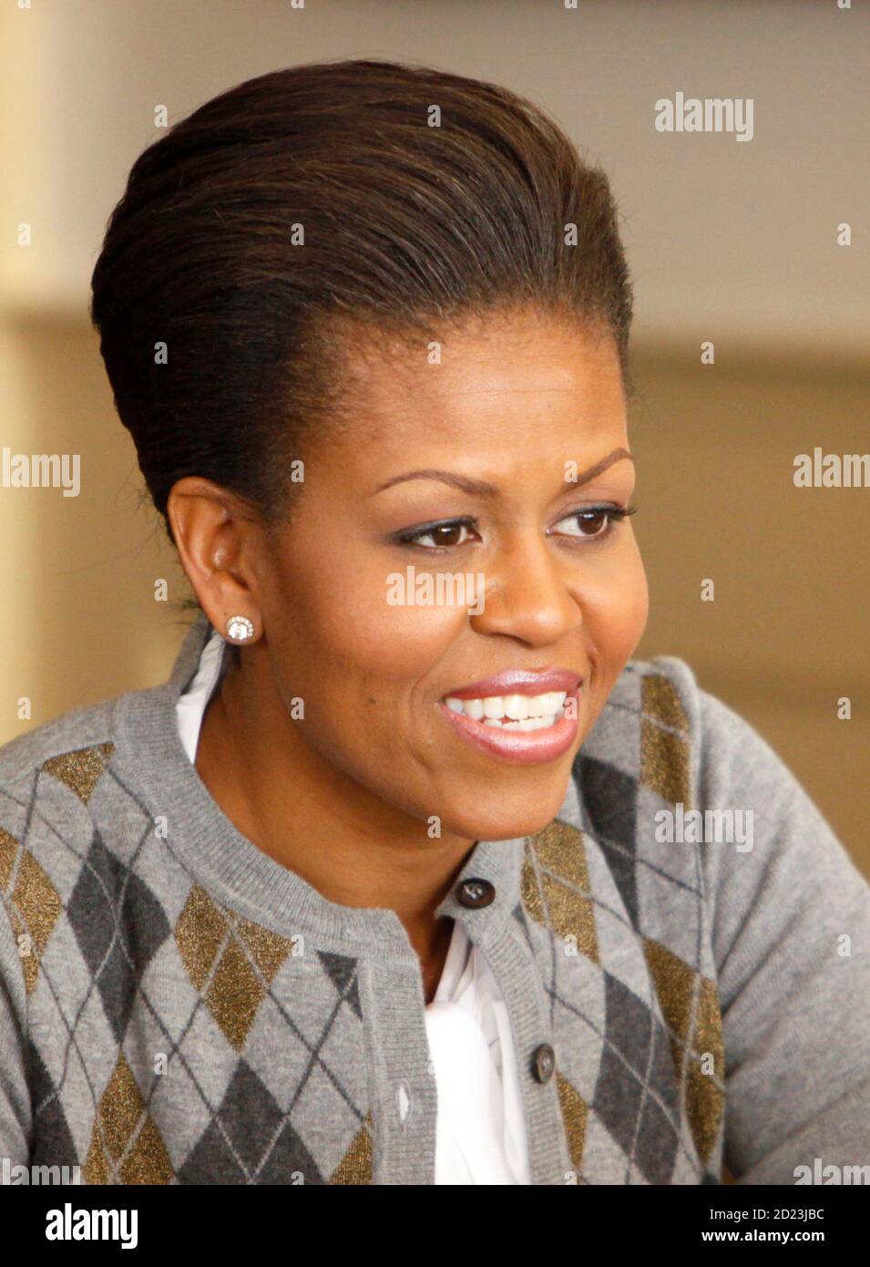 U.S. first lady Michelle Obama talks to others at her table at a Girls Mentoring Luncheon at the Governor's Mansion in Denver, Colorado November 16, 2009. REUTERS/Rick Wilking (UNITED STATES POLITICS HEADSHOT EDUCATION) Stock Photo