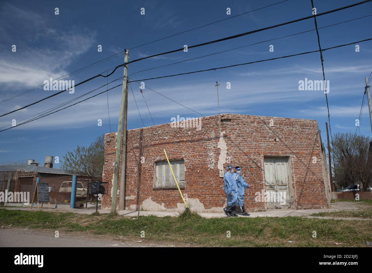 FIRMAT, ARGENTINA - Sep 17, 2020: Two volunteers walk house by house interviewing people to detect COVID-19 symptons and get them swabbed for confirma Stock Photo