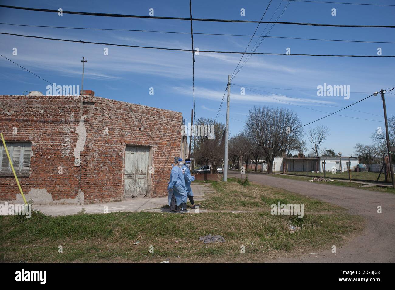FIRMAT, ARGENTINA - Sep 17, 2020: Two volunteers walk house by house interviewing people to detect COVID-19 symptons and get them swabbed for confirma Stock Photo