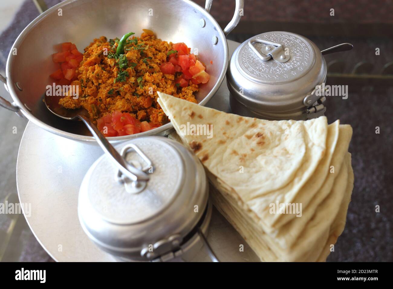 Bahrain breakfast of eggs, tomatoes, chillies and flat bread, the
