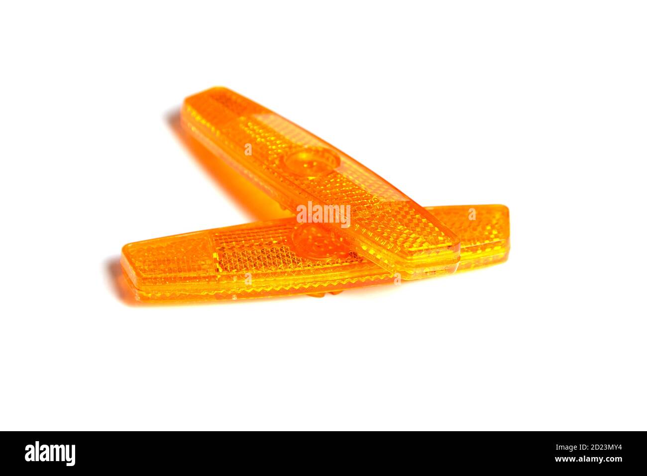 Bicycle wheel reflectors isolated on white background. Two orange