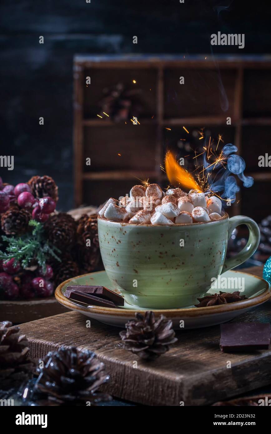 Christmas hot chocolate with marshmallow and with sparklers. New year composition with copy space. Stock Photo
