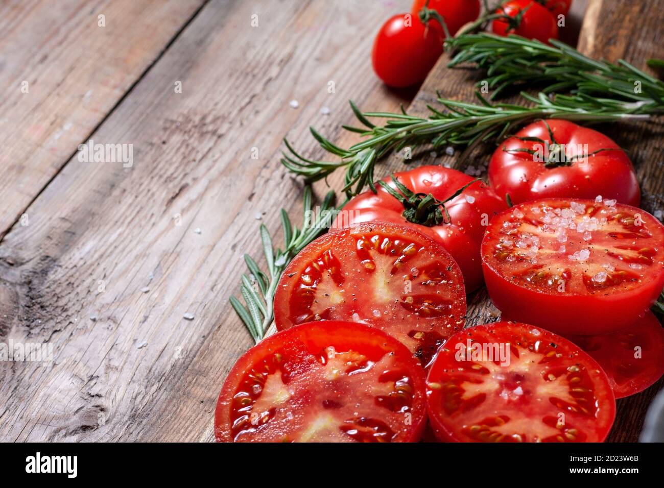 Sliced Tomato. Red tomatoes on a Wooden Cutting Board Stock Photo - Alamy