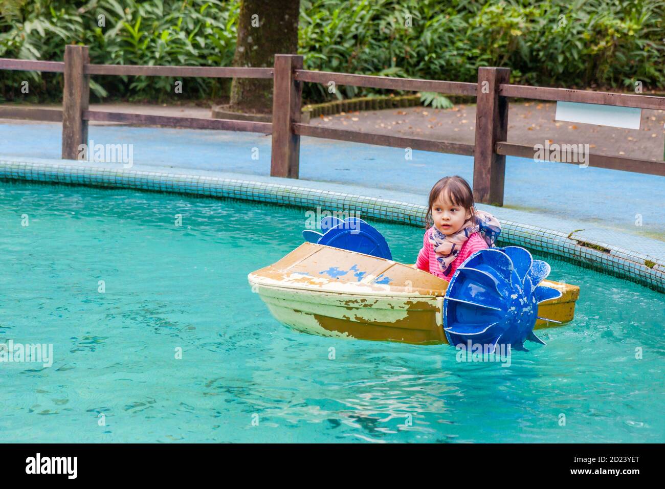 Young girl in hand paddle boat Stock Photo Alamy