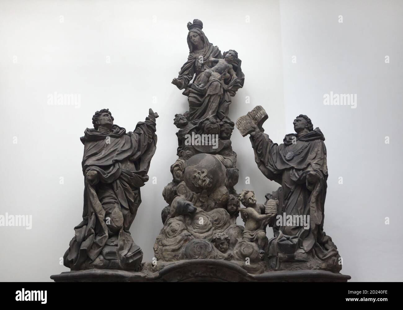 Original statue of Madonna with Saint Dominic and Saint Thomas Aquinas by Lusatian Baroque sculptor Matěj Václav Jäckel (1708) once placed on the Charles Bridge in Prague, now on display in the Lapidarium of the National Museum (Lapidárium Národního muzea) in Prague, Czech Republic. Stock Photo