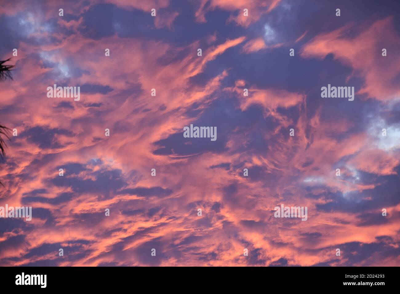 Cloudscape fire dancing in the dark stormy sunset sky Stock Photo