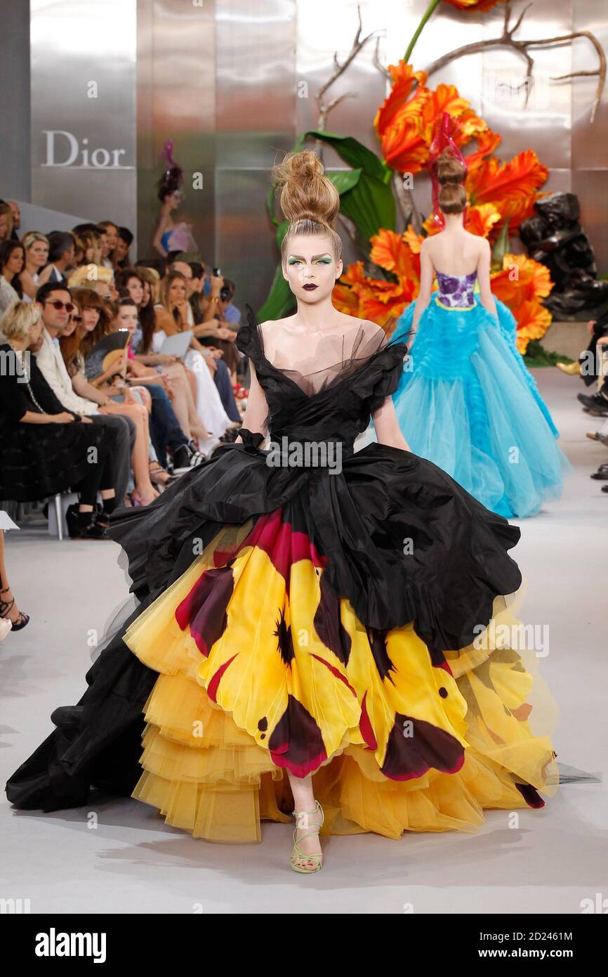 Models present creations by British designer John Galliano as part of his  Fall/Winter 2010-2011 Haute Couture fashion show for French fashion house  Dior in Paris July 5, 2010. REUTERS/Benoit Tessier (FRANCE -