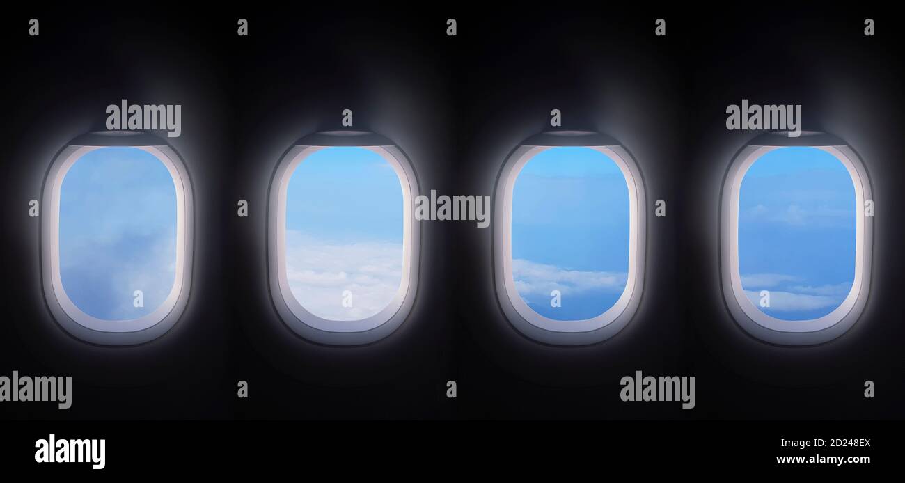 four airplane windows open white window shutter wide with blue sky view. plane portholes usable for banners, brochures in tourism theme. air traveling Stock Photo