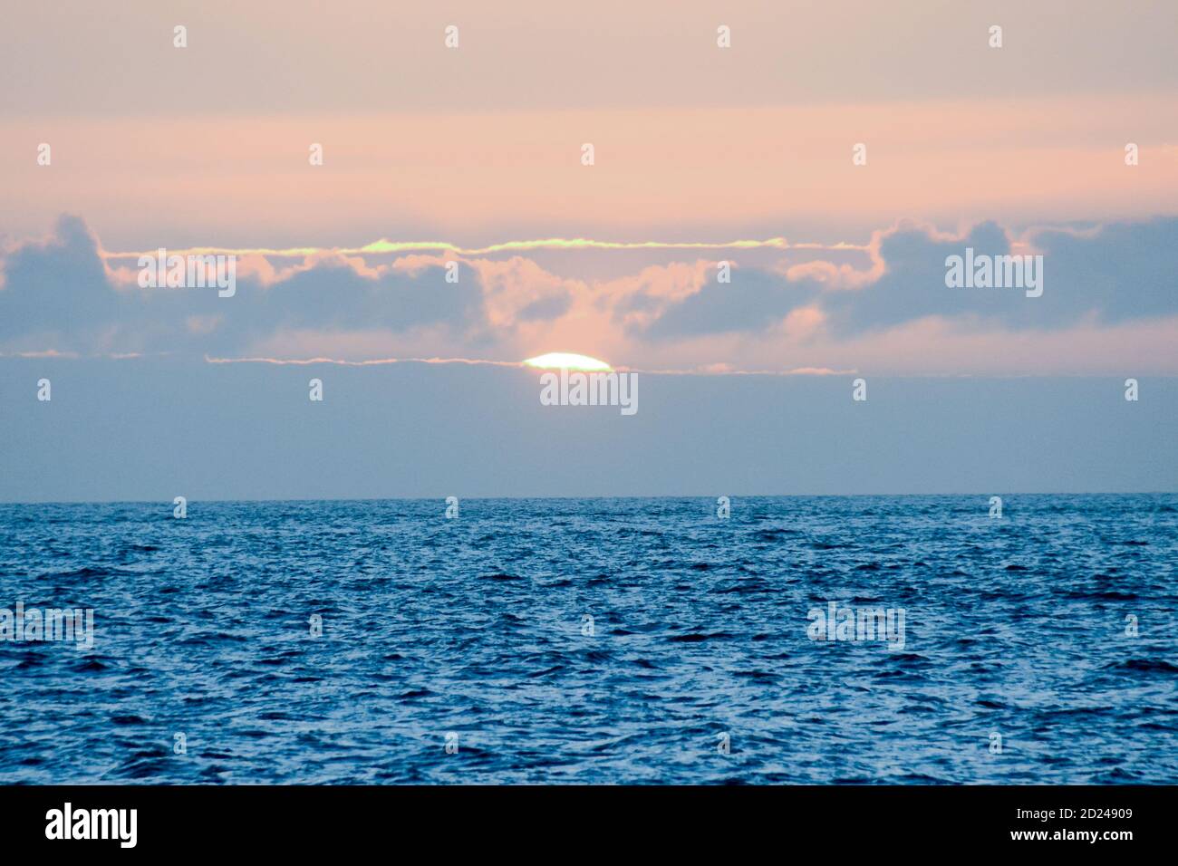 The Sun Setting in the Sea Stock Photo - Alamy