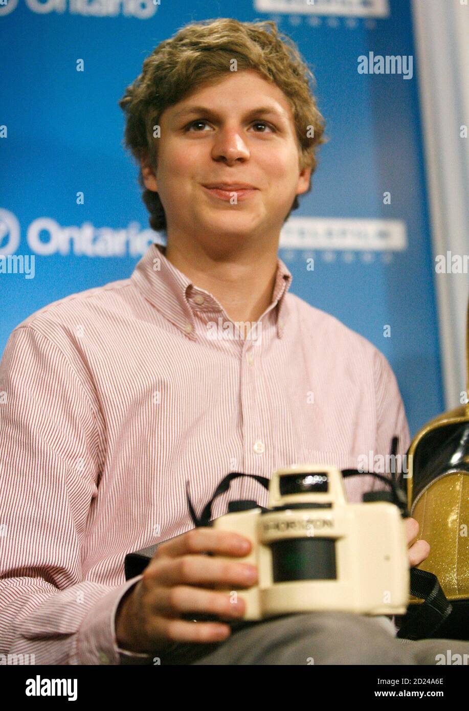 Cast Member Michael Cera Takes A Picture During A News Conference For The Movie Juno During The 32nd Toronto International Film Festival In Toronto September 8 2007 The Festival Runs From September