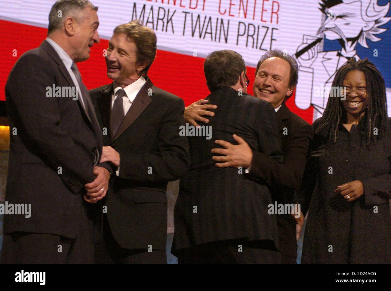 Actor and comedian Billy Crystal (2nd R) is hugged by fellow actor and  comedian Robin Williams as they are joined by actors Robert de Niro (L),  Martin Short (2nd L) and Whoopi