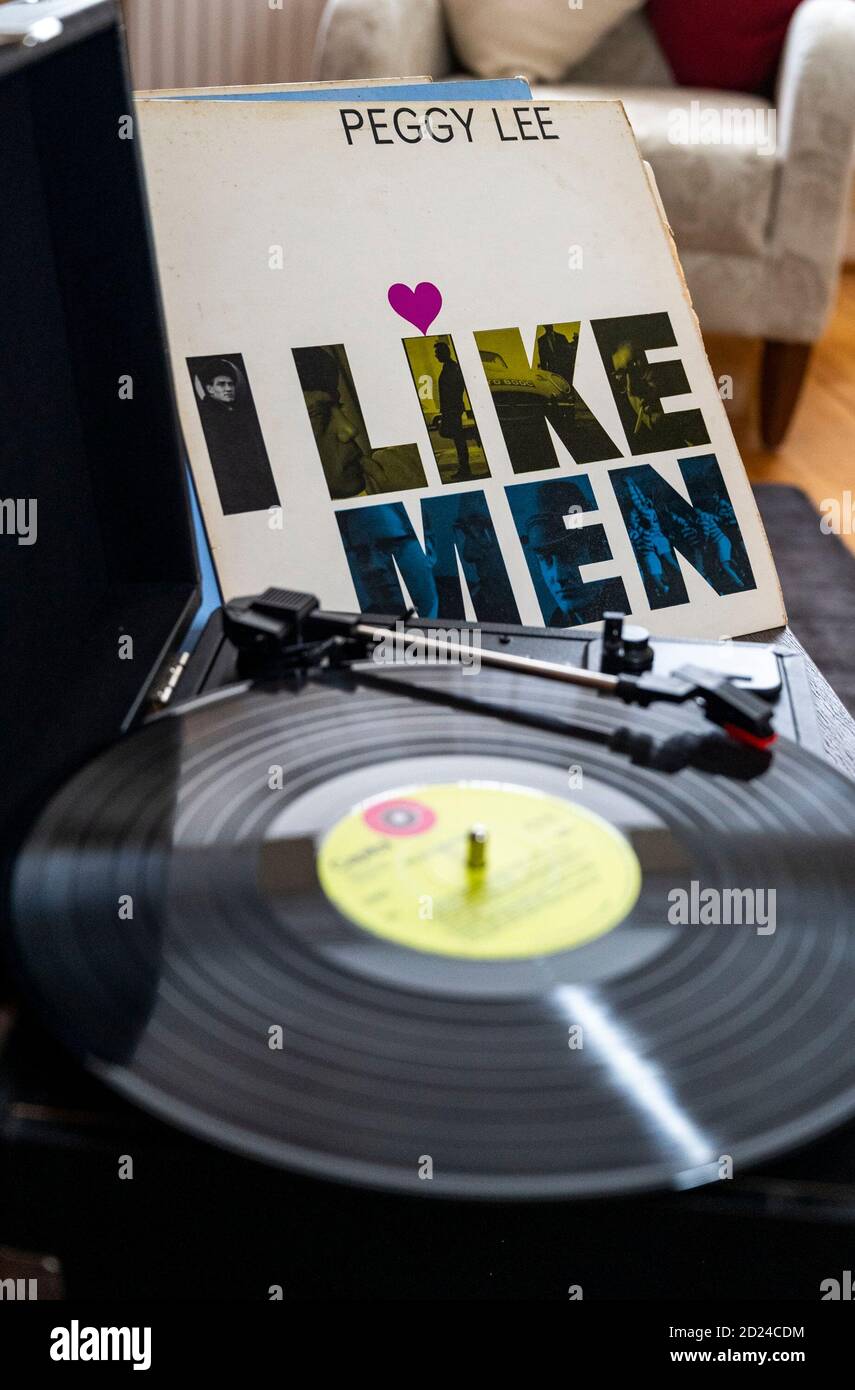 Selection of Peggy Lee albums playing on portable record player . I Like Men! is a 1959 studio album recorded by Peggy Lee conducted by Jack Marshall.  Photograph taken by Simon Dack Stock Photo