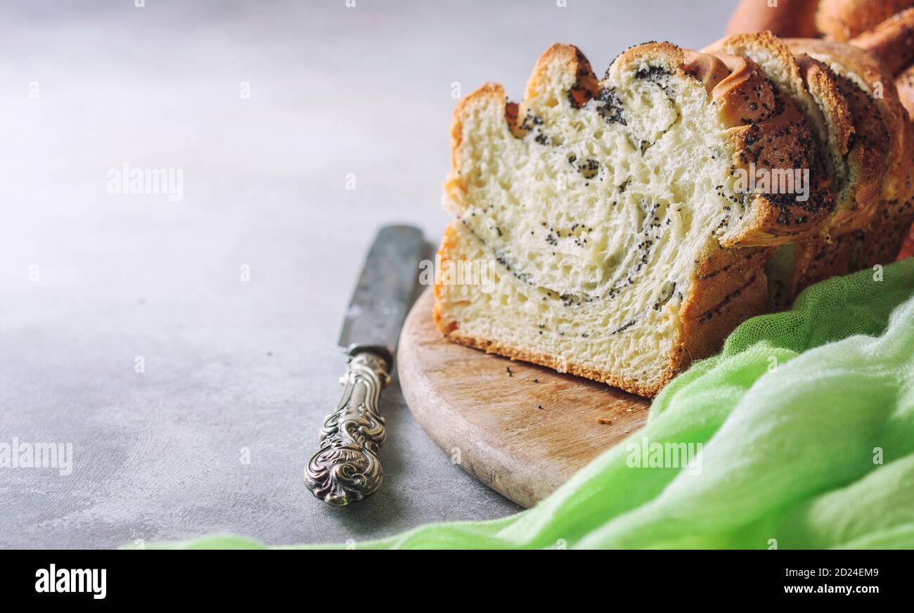 Homemade poppy seed braided bread, selective focus . Wreath. National