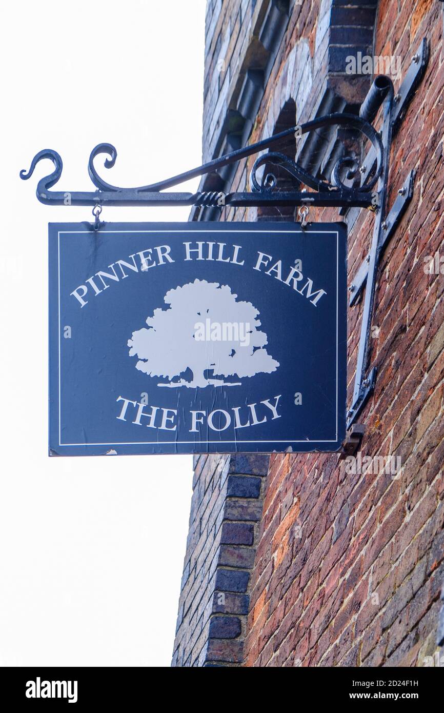 Pinner Hill Farm The Folly Extended sign with illustration of a tree on the side of Grade II listed Tooke’s Folly Clock Tower. Harrow, NW London Stock Photo