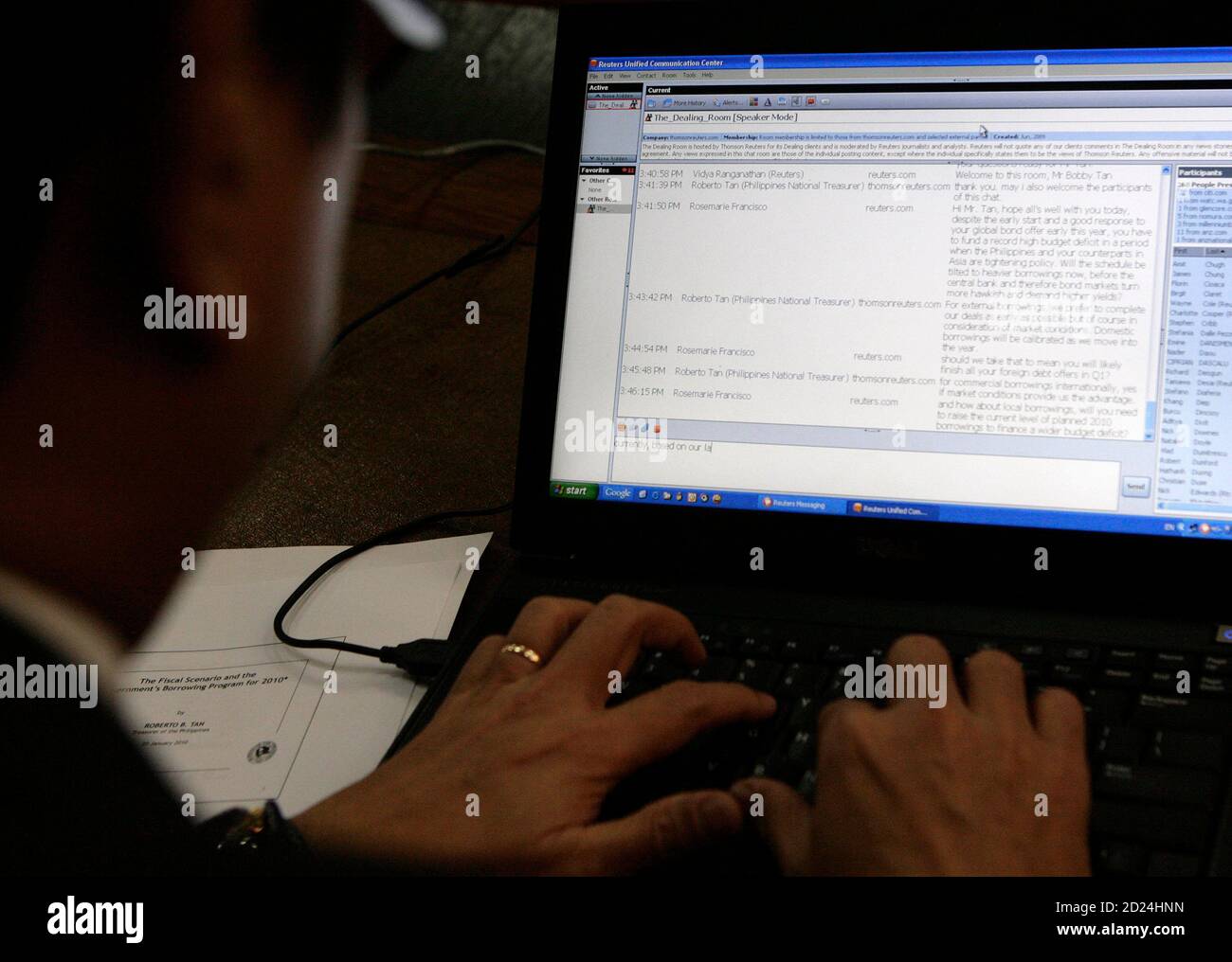 National Treasurer Roberto Tan types his answer in the Dealing Room, a Reuters Messaging chatroom, during an interview in Manila January 25, 2010. The Philippines may complete its foreign debt issues for this year by March if market conditions are good, Tan said on Monday.  REUTERS/Cheryl Ravelo  (PHILIPPINES - Tags: BUSINESS) Stock Photo