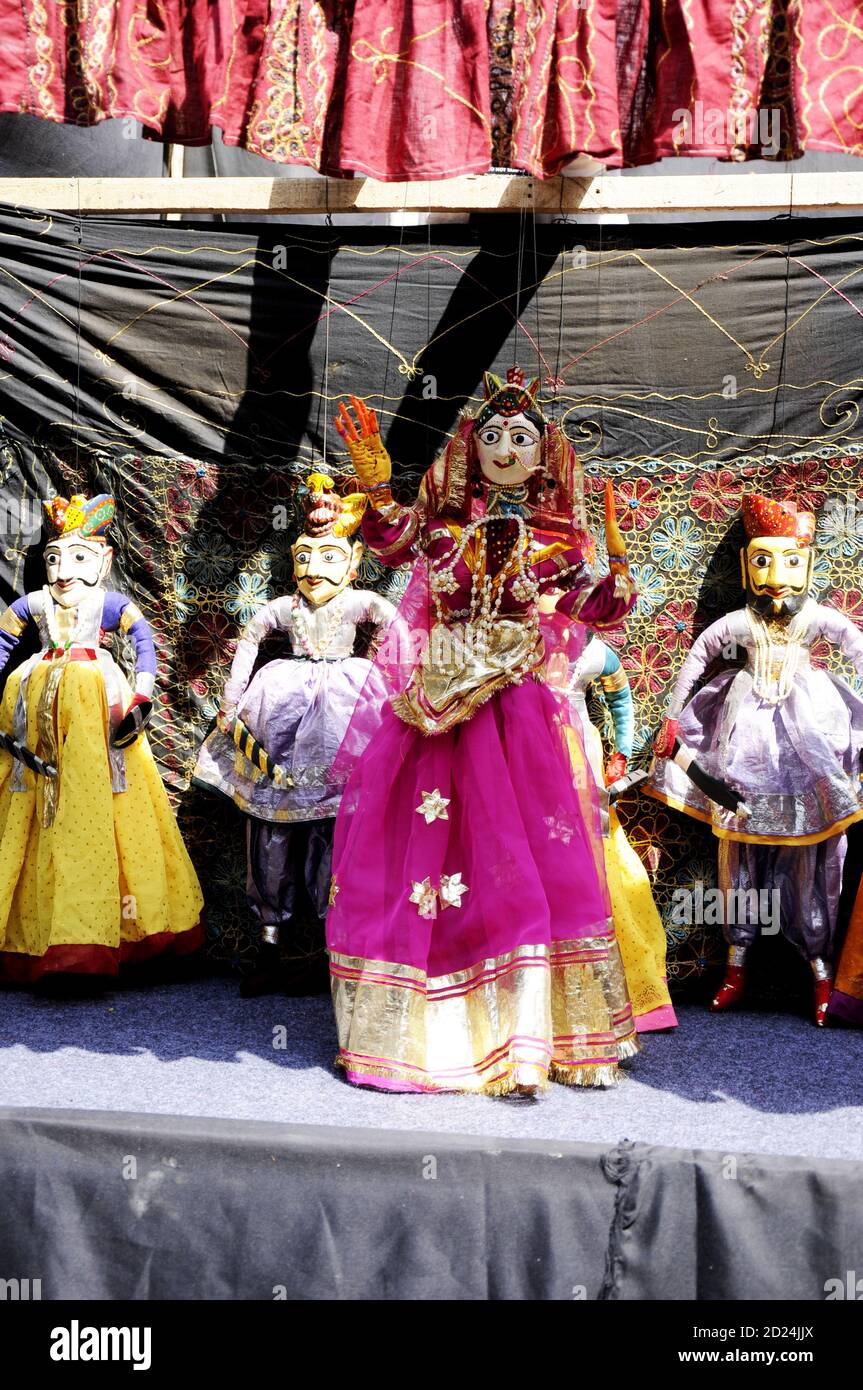 Colorful Rajasthani puppet dolls of Jaisalmer. Traditional puppet shows in Rajasthan is a popular tourist attraction. Stock Photo