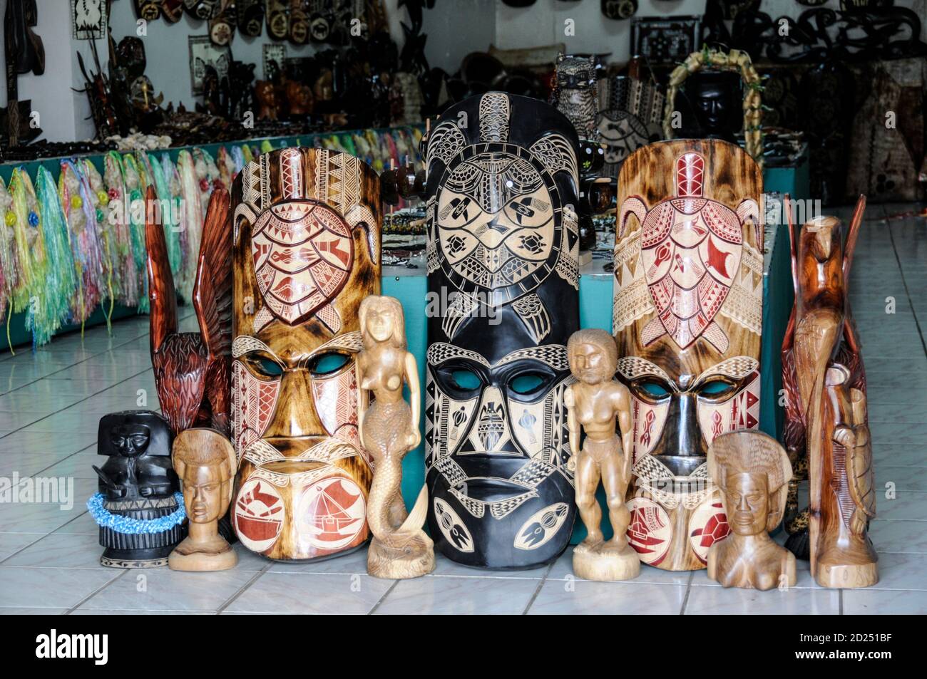 A selection of traditional Fijian woodcarvings on sale in a tourist souvenir shop in Fiji in the