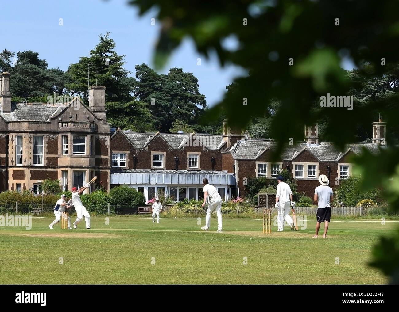 Cricket on the village green Sandringham Norfolk U.K. Stock Photo