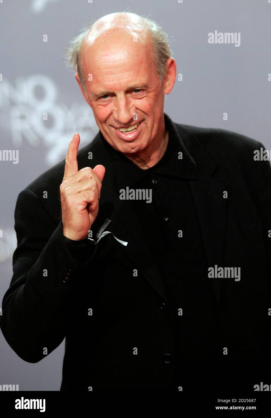 German fashion designer Willy Bogner poses on the red carpet for the German  premiere of the latest James Bond movie "Casino Royale" in Berlin November  21, 2006. "Casino Royale" will open in