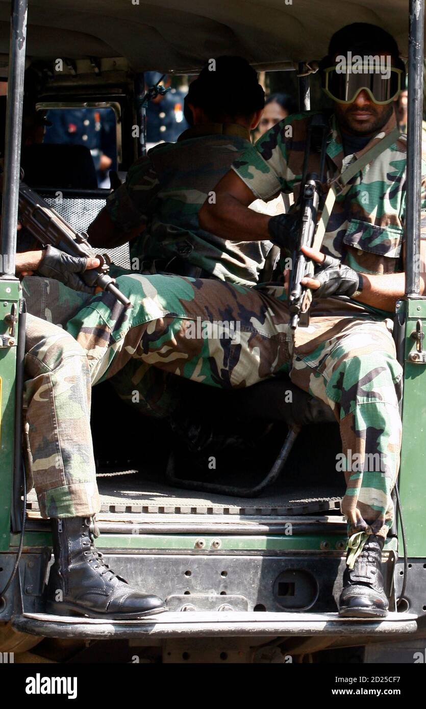 Special training soldiers of VIP military commandeering officers security  travel by backup jeep after a commemorative wreath laying ceremony in  remembrance of the contribution of those that died in both World Wars