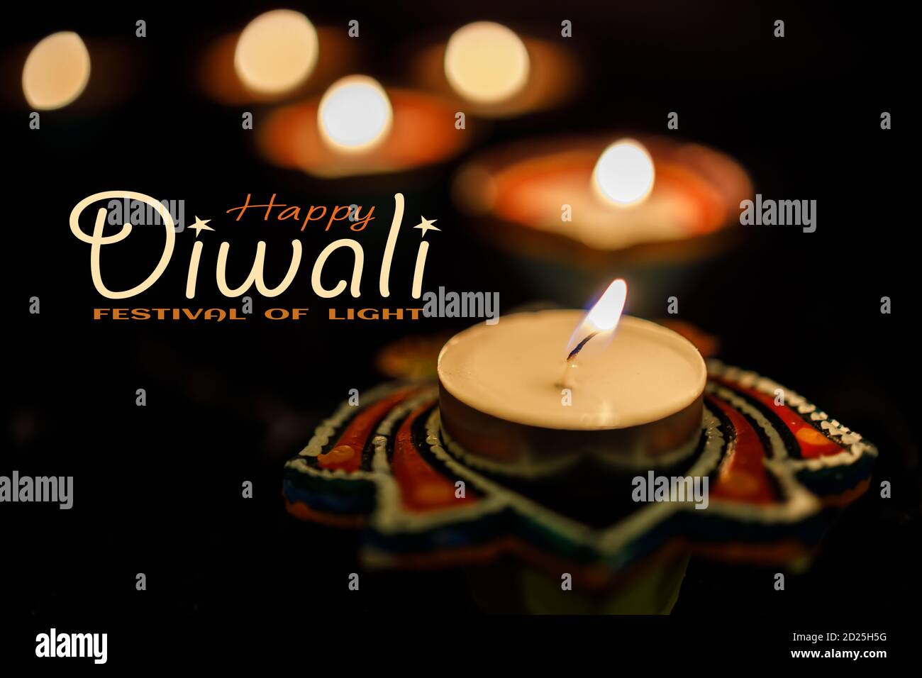 Happy Diwali Clay Diya lamps lit during Dipavali, Hindu festival of