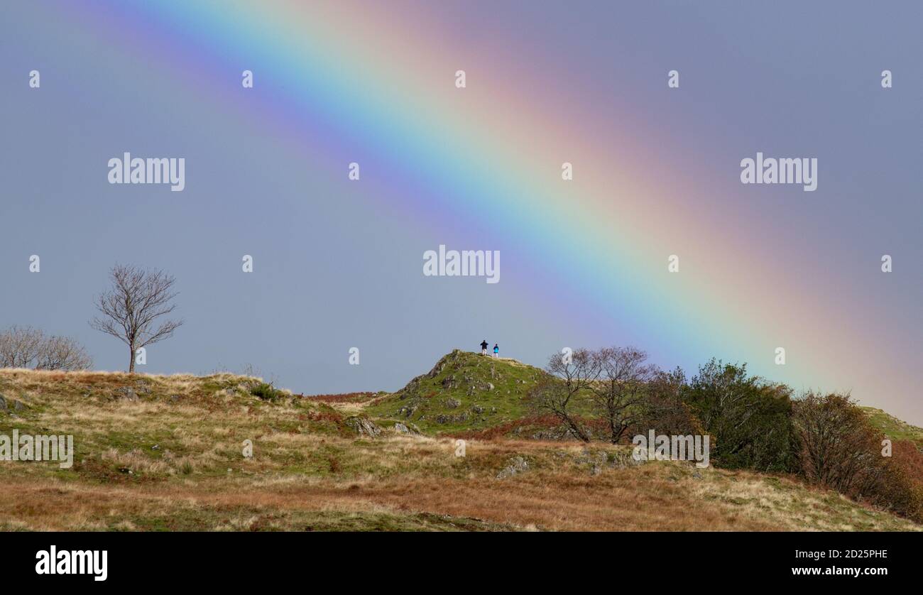 Coniston, Cumbria, UK. 6th Oct, 2020. A spectacular rainbow, the result of a showery day in the Lake District at Coniston, Cumbria. Credit: John Eveson/Alamy Live News Stock Photo