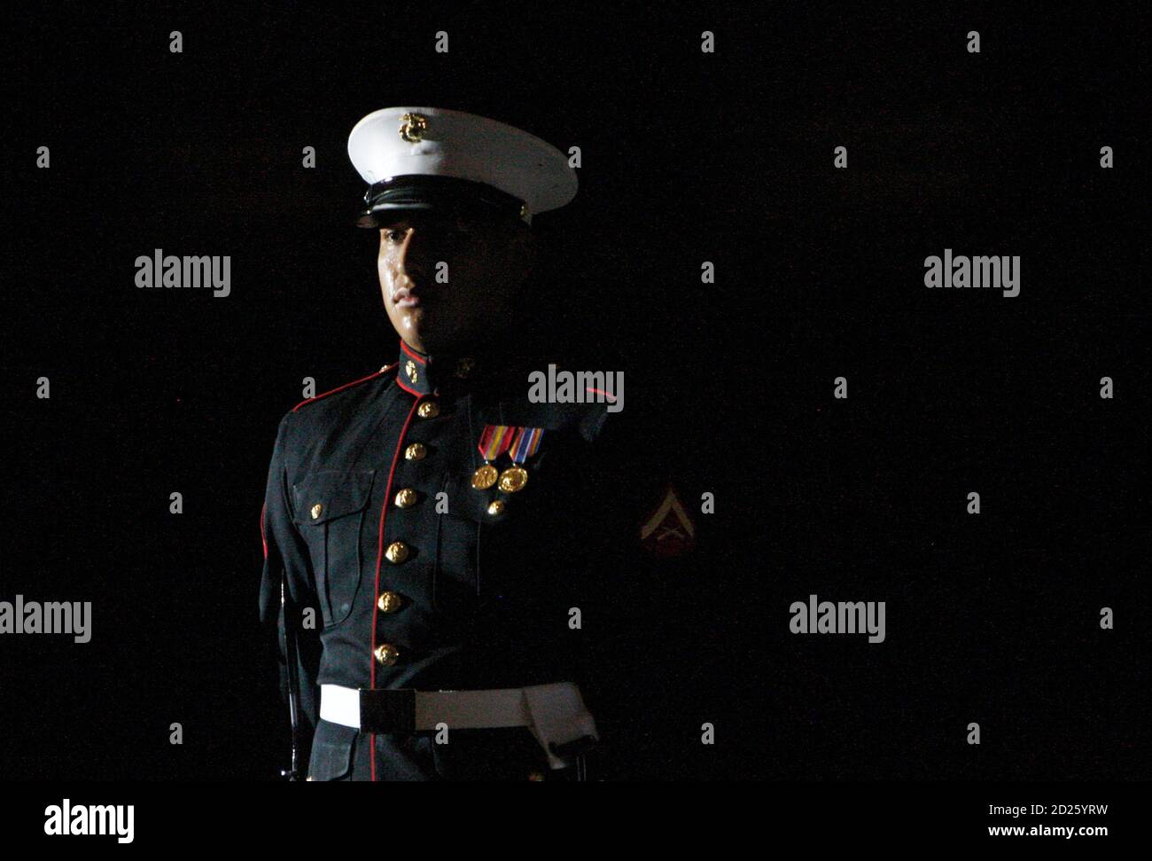 A member of the U.S. Marines Corps Silent Drill Exhibition Platoon takes part in the Evening Parade at the Marine Barracks in Washington, July 24, 2009.   REUTERS/Jim Young    (UNITED STATES POLITICS MILITARY) Stock Photo
