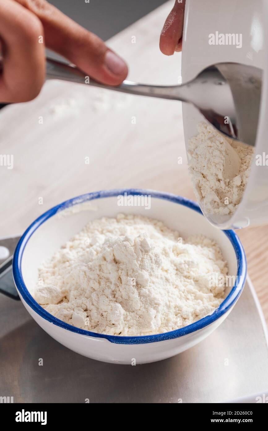 Woman pouring milk into a bowl hires stock photography and images Alamy