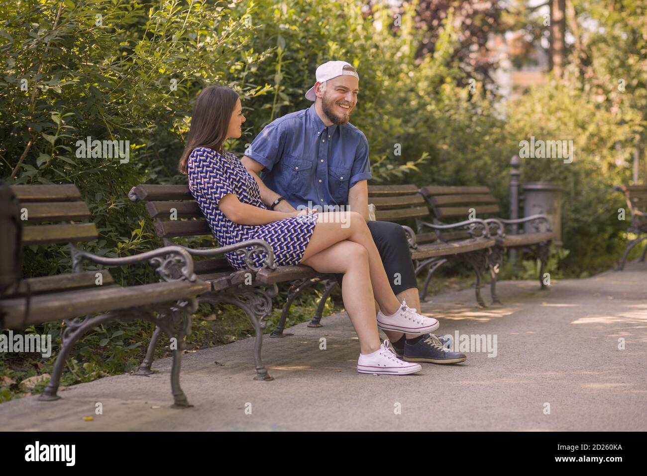 Happy young couple enjoys spring day in park. Stock Photo