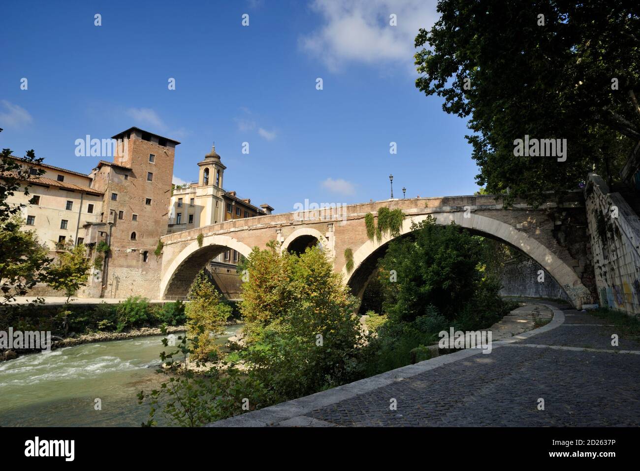 italy, rome, tiber river, isola tiberina, pons fabricius, ponte fabricio, ancient roman bridge (62 BC) and torre dei caetani tower Stock Photo