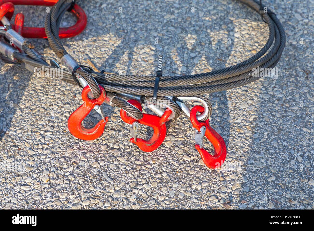 Three Red Hooks and Steel Wire Cable Stock Photo Alamy