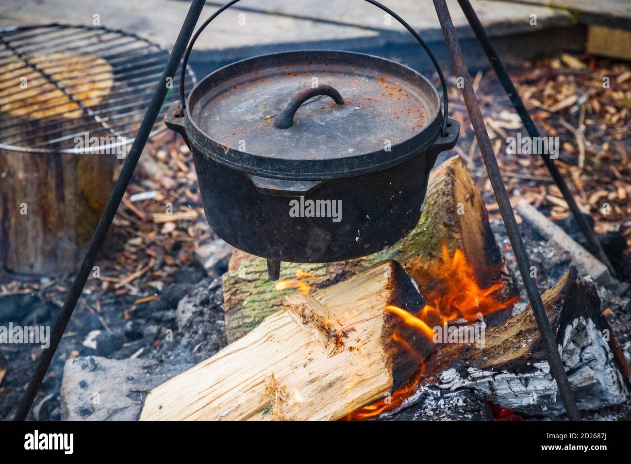 Cooking food in a cauldron over campfire in England Stock Photo - Alamy