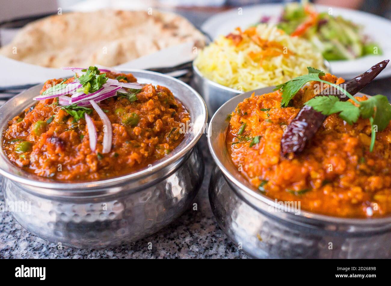 Indian dish Lamb keema and chili garlic chicken with rice and naan bread Credit Euan Cherry