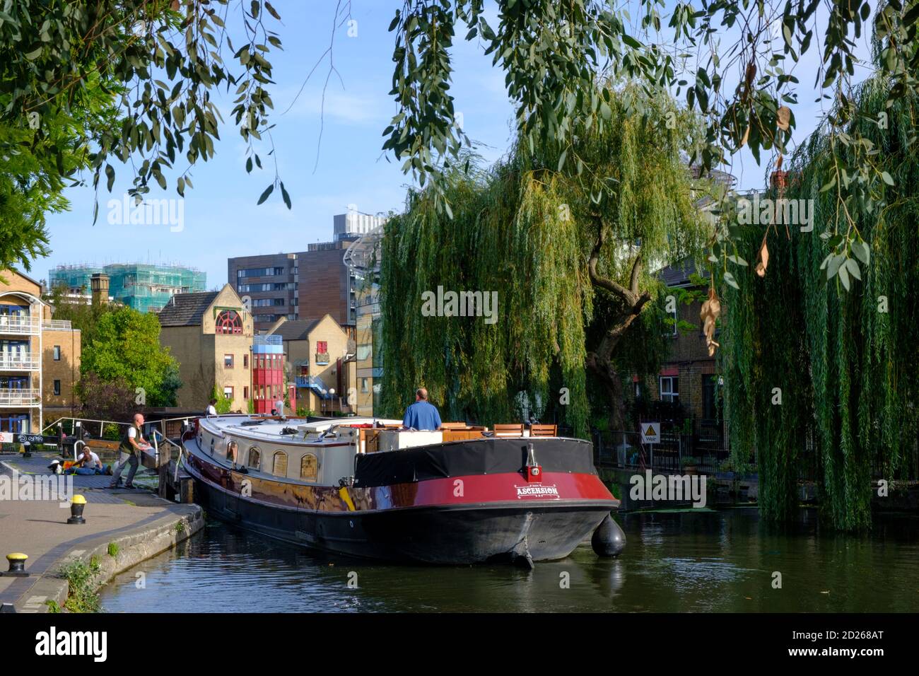 UK, London, Canal barge at the Kentish Town Lock, a lock gate on the Regents Canal, public footpath, summer, urban skyline, tranquil scene Stock Photo