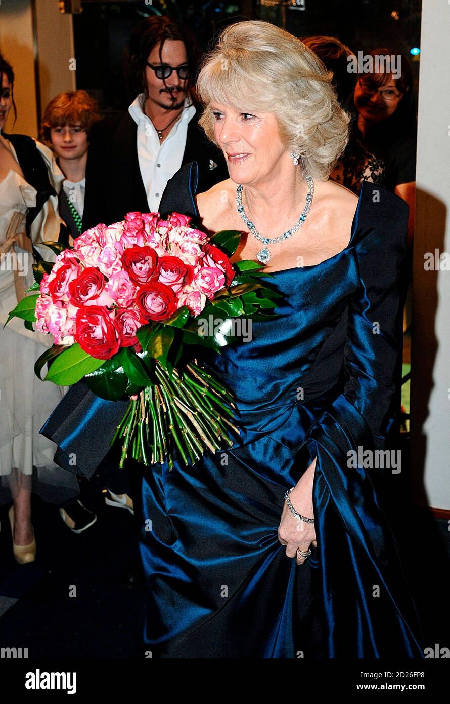 britains-camilla-duchess-of-cornwall-receives-a-bouquet-of-flowers-as-she-arrives-at-the-royal-world-premiere-of-alice-in-wonderland-in-london-february-25-2010-reutersian-westpool-britain-tags-entertainment-royals-2D26FP8.jpg