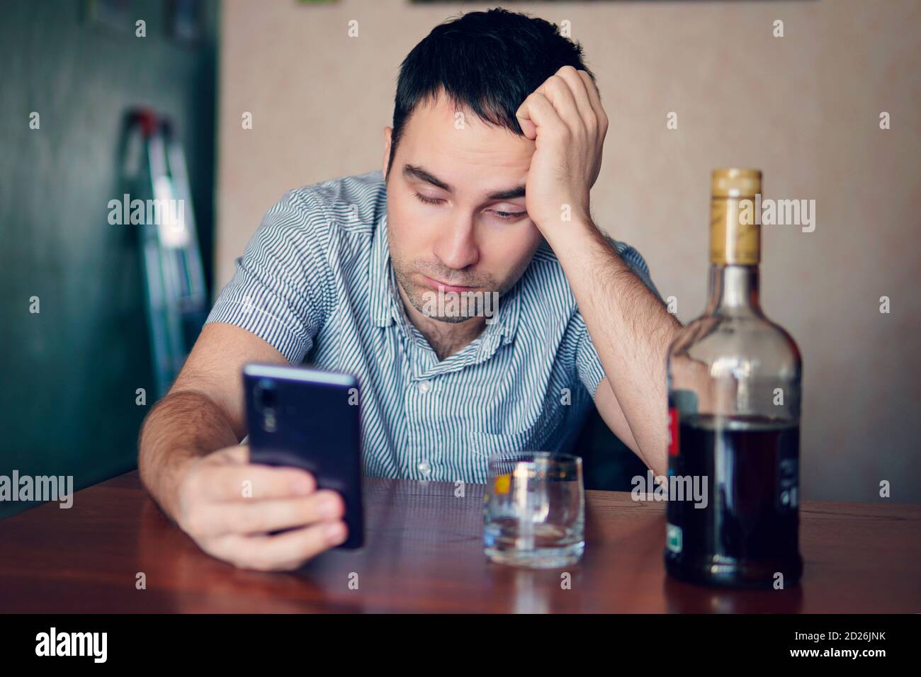 An unemployed specialist who got drunk alone out of boredom is quarantined in self-isolation. alcoholism, alcohol addiction and people concept - male Stock Photo