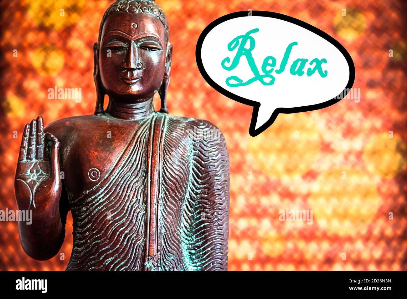 Buddah Sculpture and a Speech Bubble with the Word Relax Stock Photo