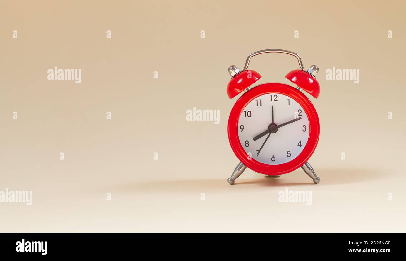 Red vintage alarm clock side view with copy space Stock Photo Alamy