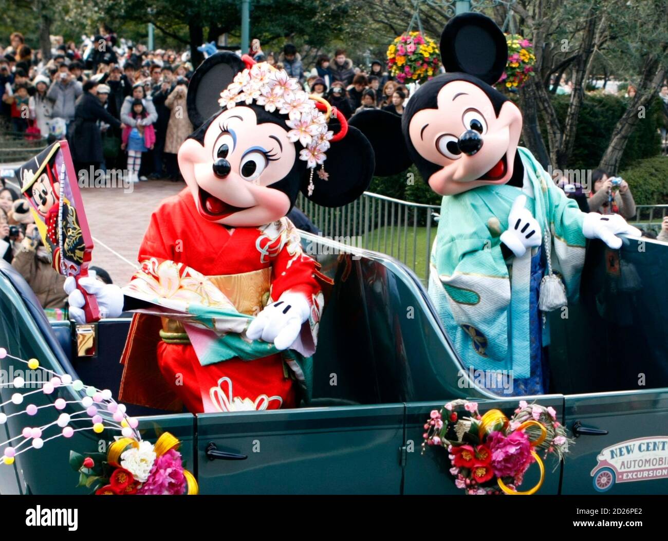 Disney cartoon characters Mickey (R) and Minnie Mouse, dressed in kimonos, wave from an open car during a New Years parade at Tokyo Disneyland in Urayasu, east of Tokyo, January 1, 2008. Disney cartoon characters Mickey (R) and Minnie Mouse, dressed in kimonos, wave from an open car during a New Years parade at Tokyo Disneyland in Urayasu, east of Tokyo, January 1, 2008.
