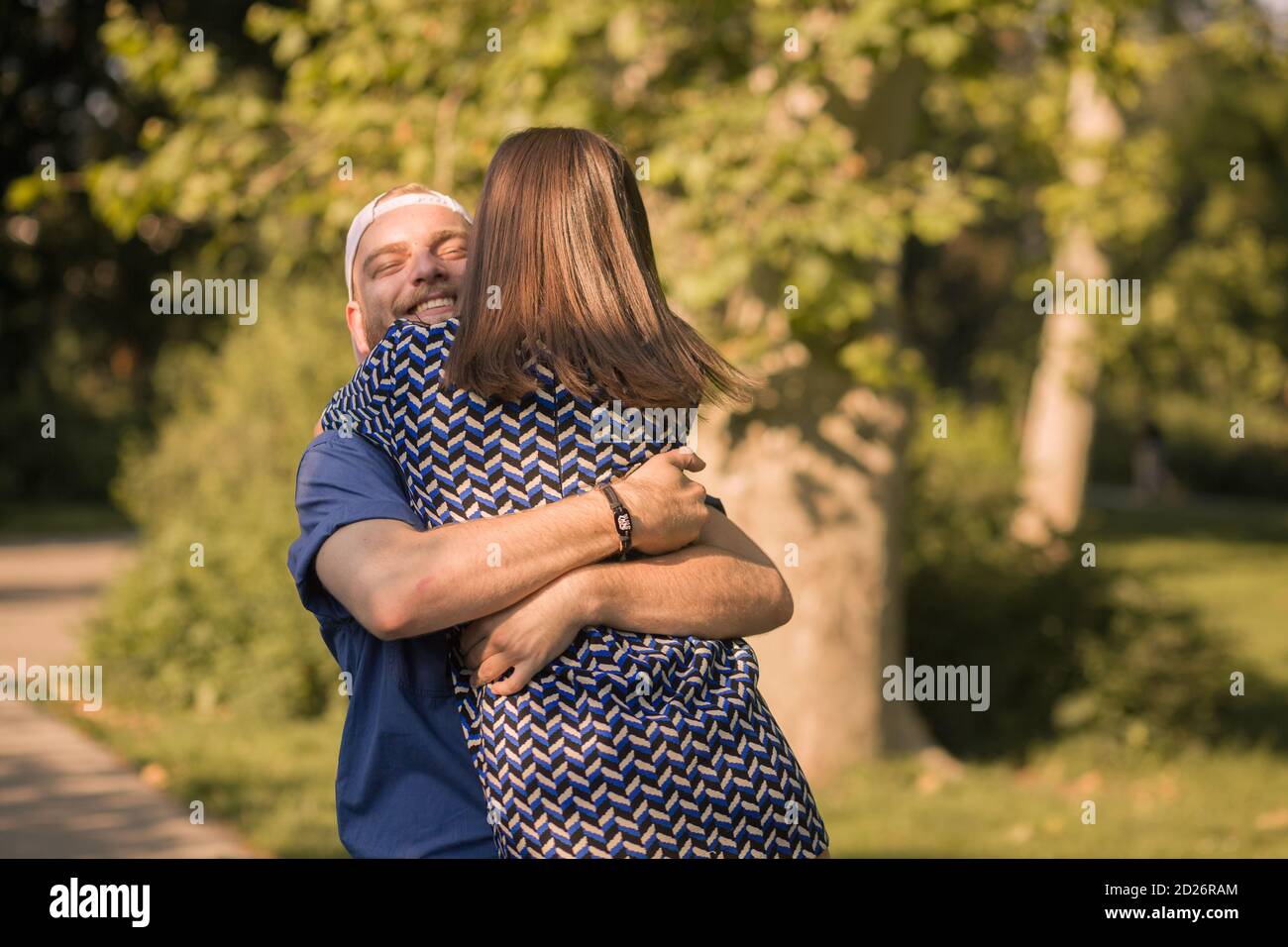 Sweet young couple hugging hi-res stock photography and images - Alamy