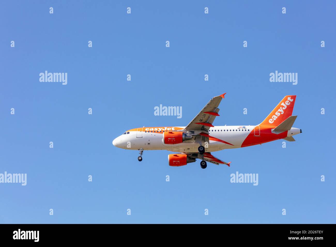 An Easyjet Europe Airbus A319-100 with landing gear down. Stock Photo