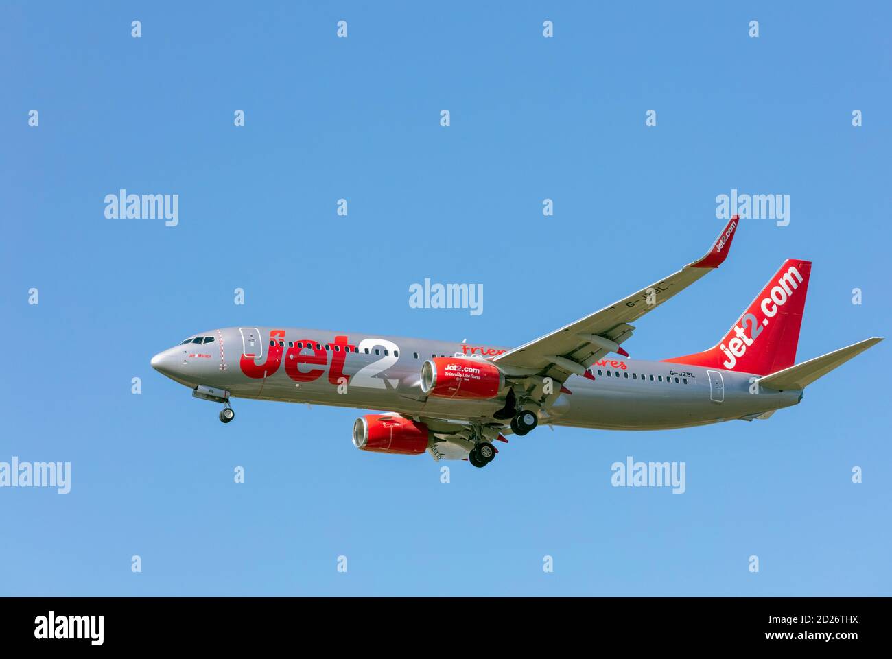 A Jet2 Boeing 737-800 with landing gear down. Stock Photo