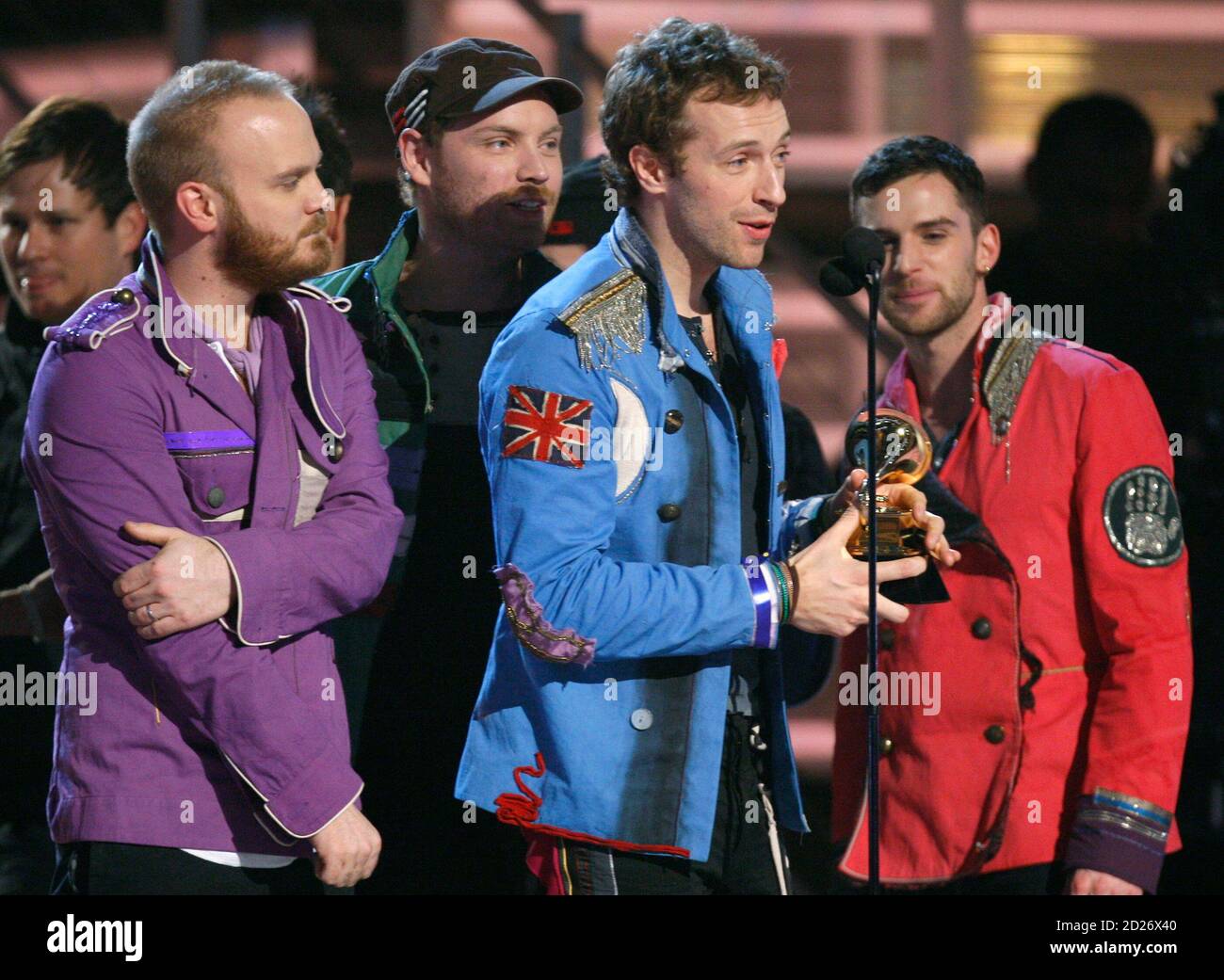 Coldplay members, Chris Martin (2nd R), Will Champion (L), Jonny Buckland  (2nd L) and Guy Berryman (R), accept the award for Best Rock Album for  their record 