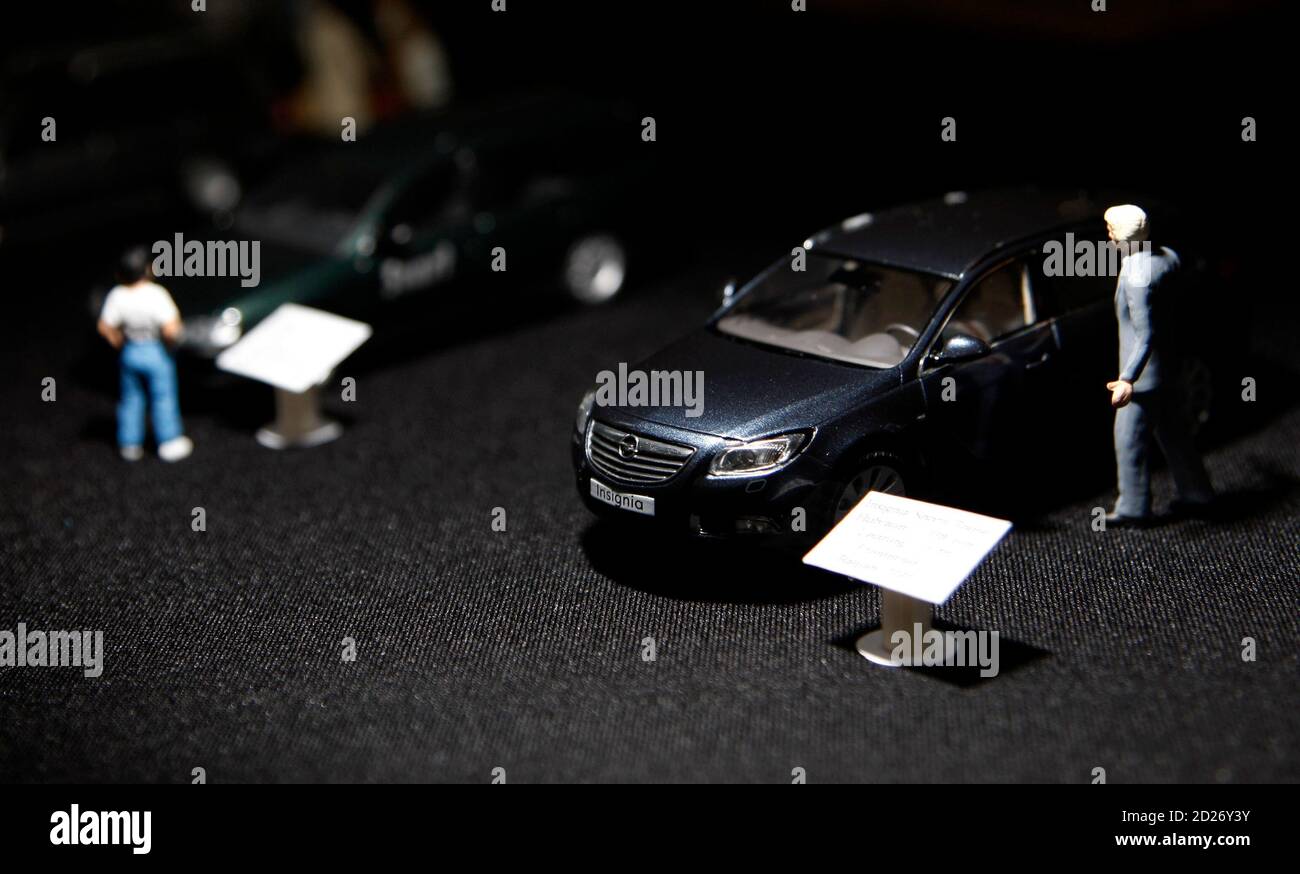 A miniature of Opel's latest model "Insignia" is pictured in the  headquarters of German car manufacturer Opel in Ruesselsheim May 26, 2009.  Germany pressed the three bidders for General Motors unit Opel