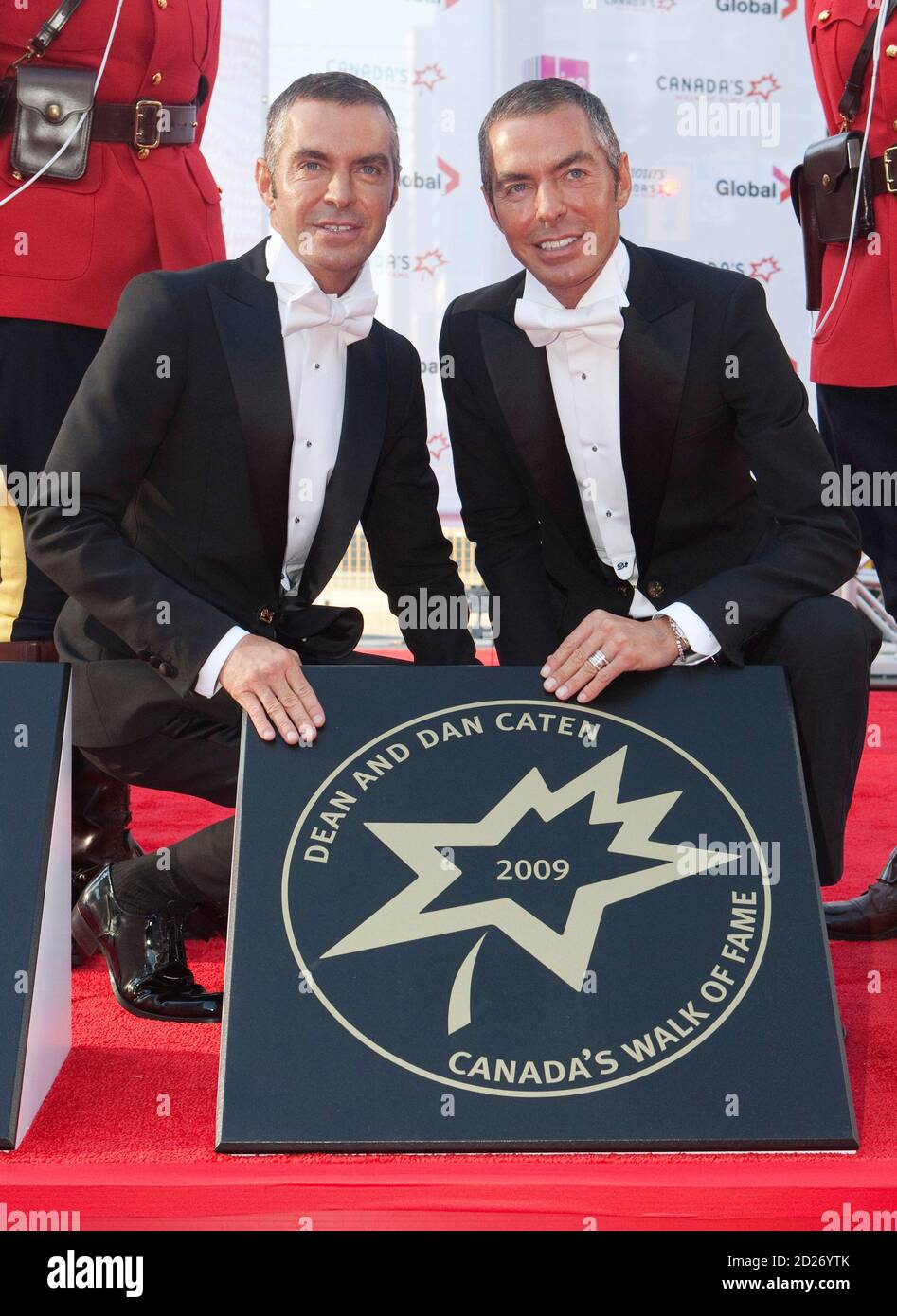 Fashion designers and twin brothers Dean and Dan Caten, also known as  Dsquared, pose with their star during the 12th annual Canada's Walk of Fame  inductee ceremony in Toronto, September 12, 2009.