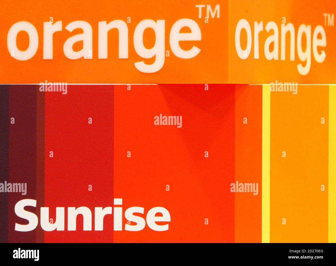 an orange logo is pictured next to a sunrise logo at shop selling mobile devices in zurich november 25 2009 according to swiss local media orange a france telecom company will buy